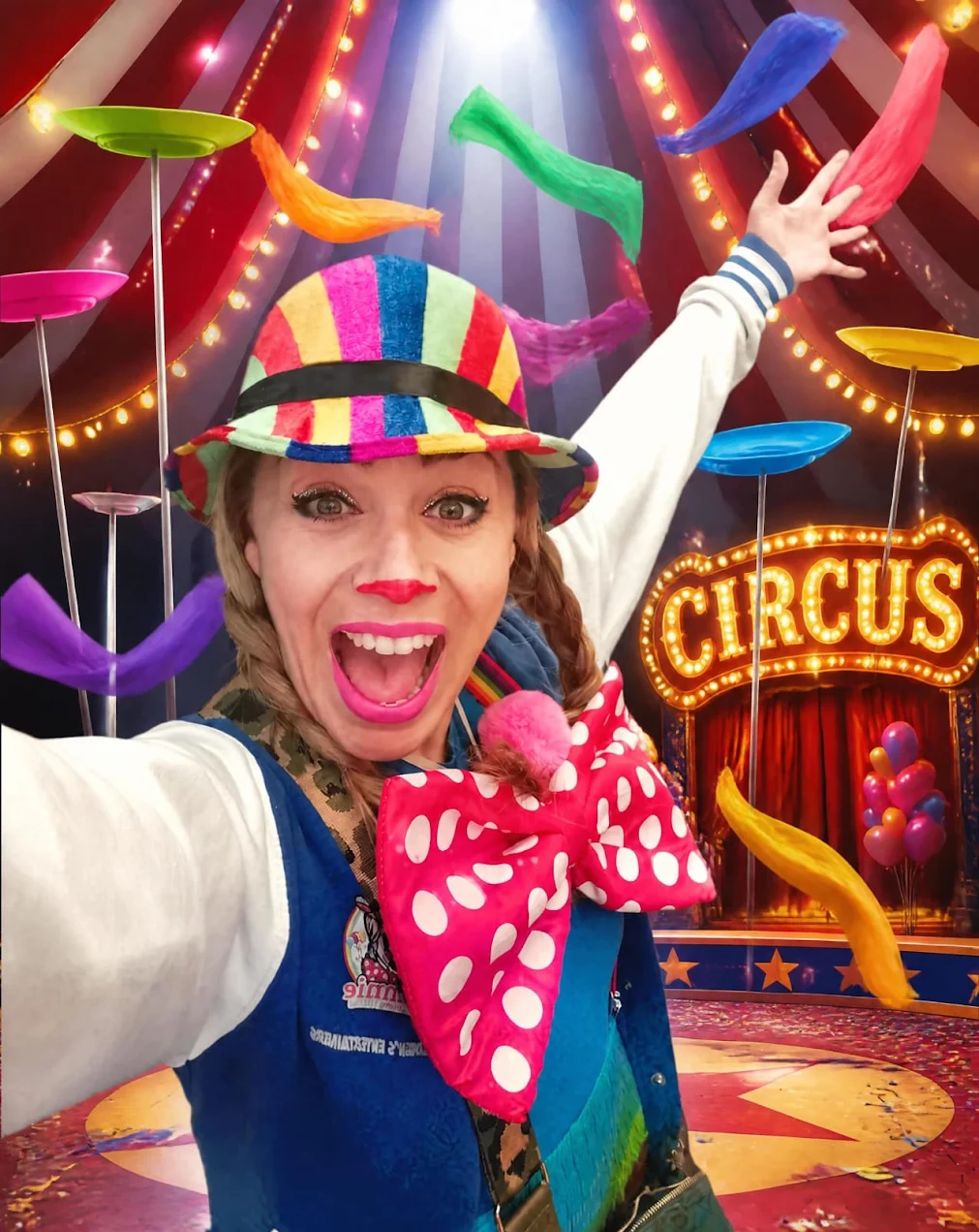Smiling clown with spinning plates under a circus tent